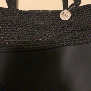 The Sak Black Handbag with Pink Liner Inside